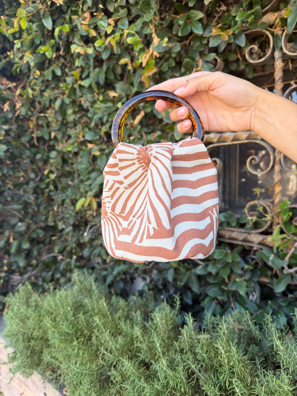 The Daisy Bag with signature tortoiseshell handles by Du Motra