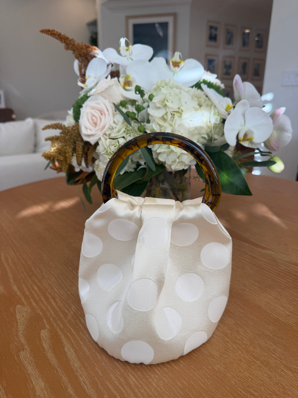 The Dottie Bag in ivory polka dot with tortoiseshell handles, handmade in Los Angeles by Du Motra