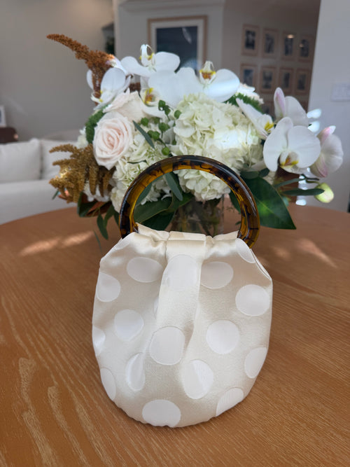 The Dottie Bag in ivory polka dot with tortoiseshell handles, handmade in Los Angeles by Du Motra