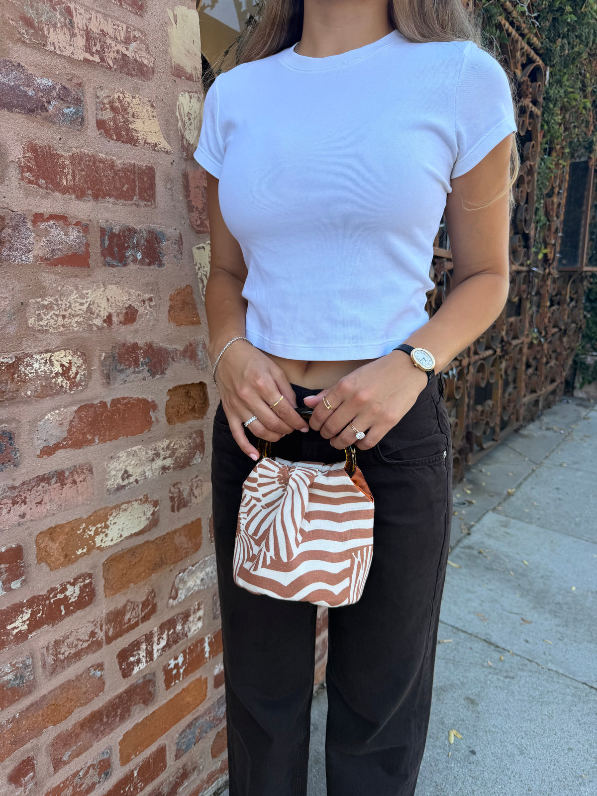 The Daisy Bag in terracotta striped print with orange satin lining by Du Motra